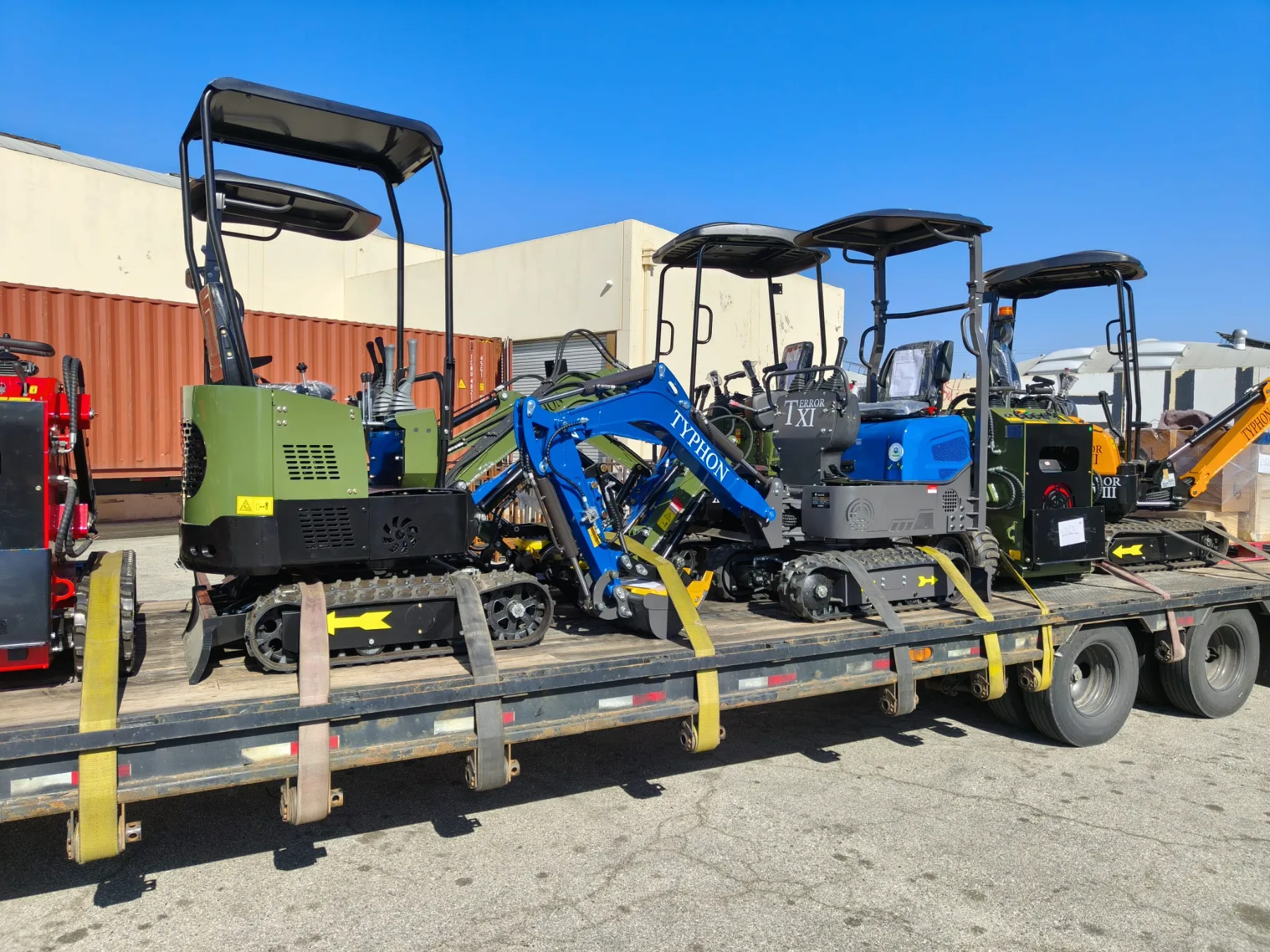 Compact mini track loader parked in loading yard