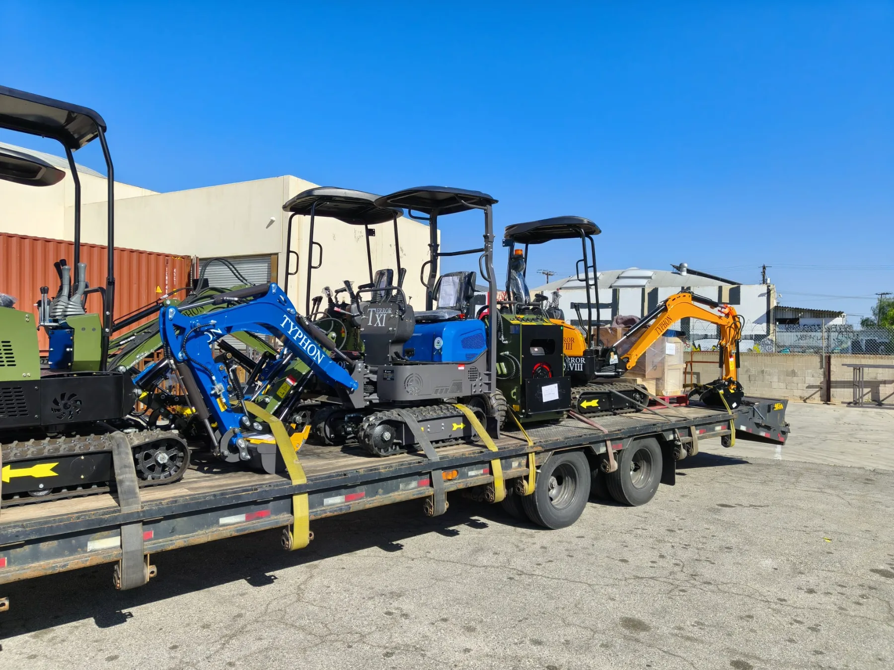 Durable rubber track assembly and bogie wheels on compact machine