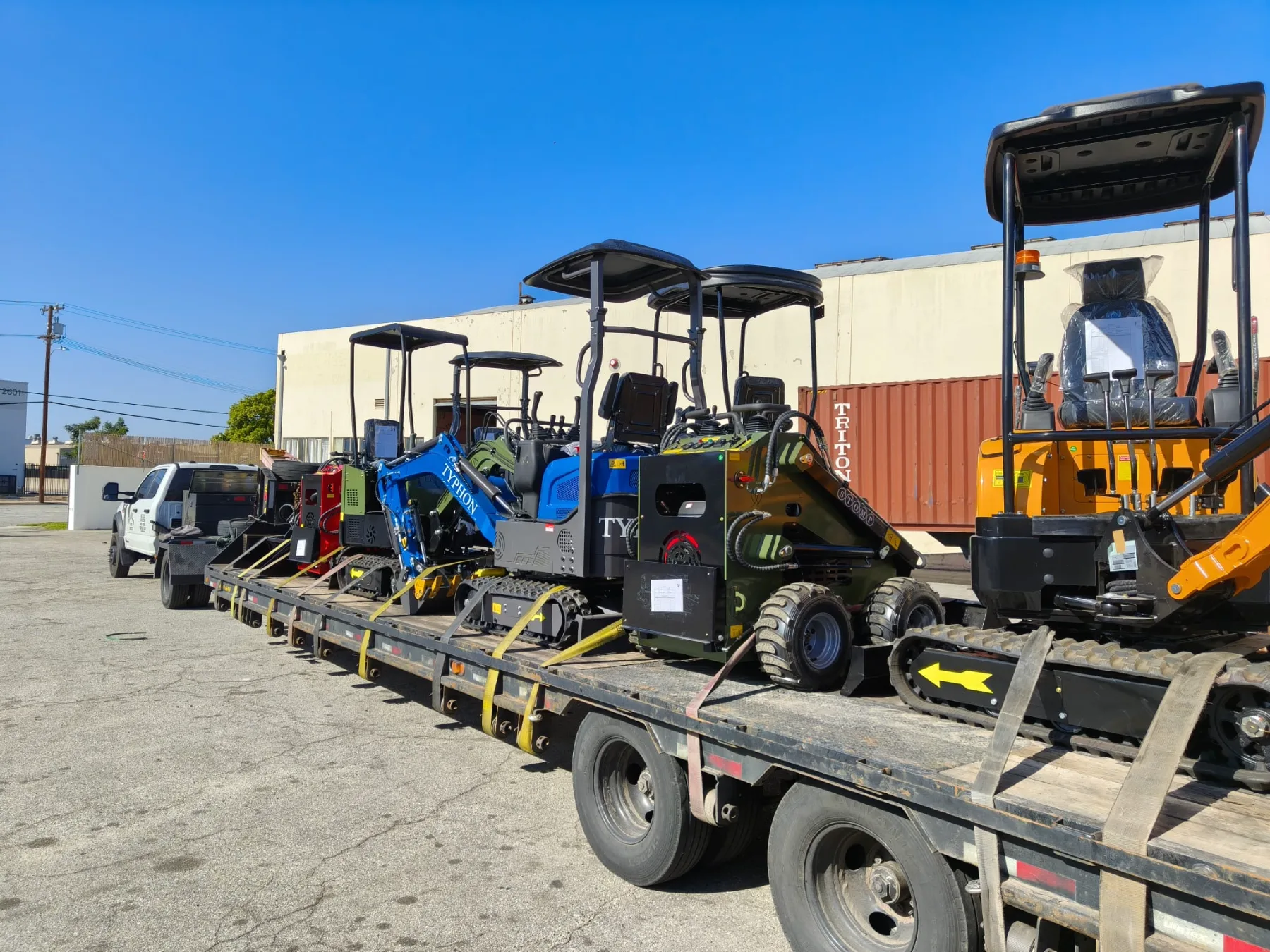 Ergonomic operator controls on stand-on compact track loader