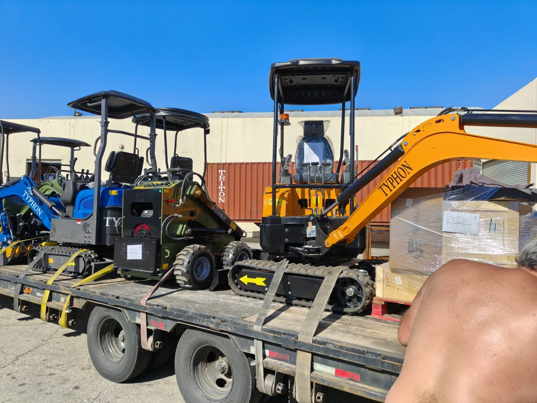 Wide shot of machinery yard with mini diggers and loaders