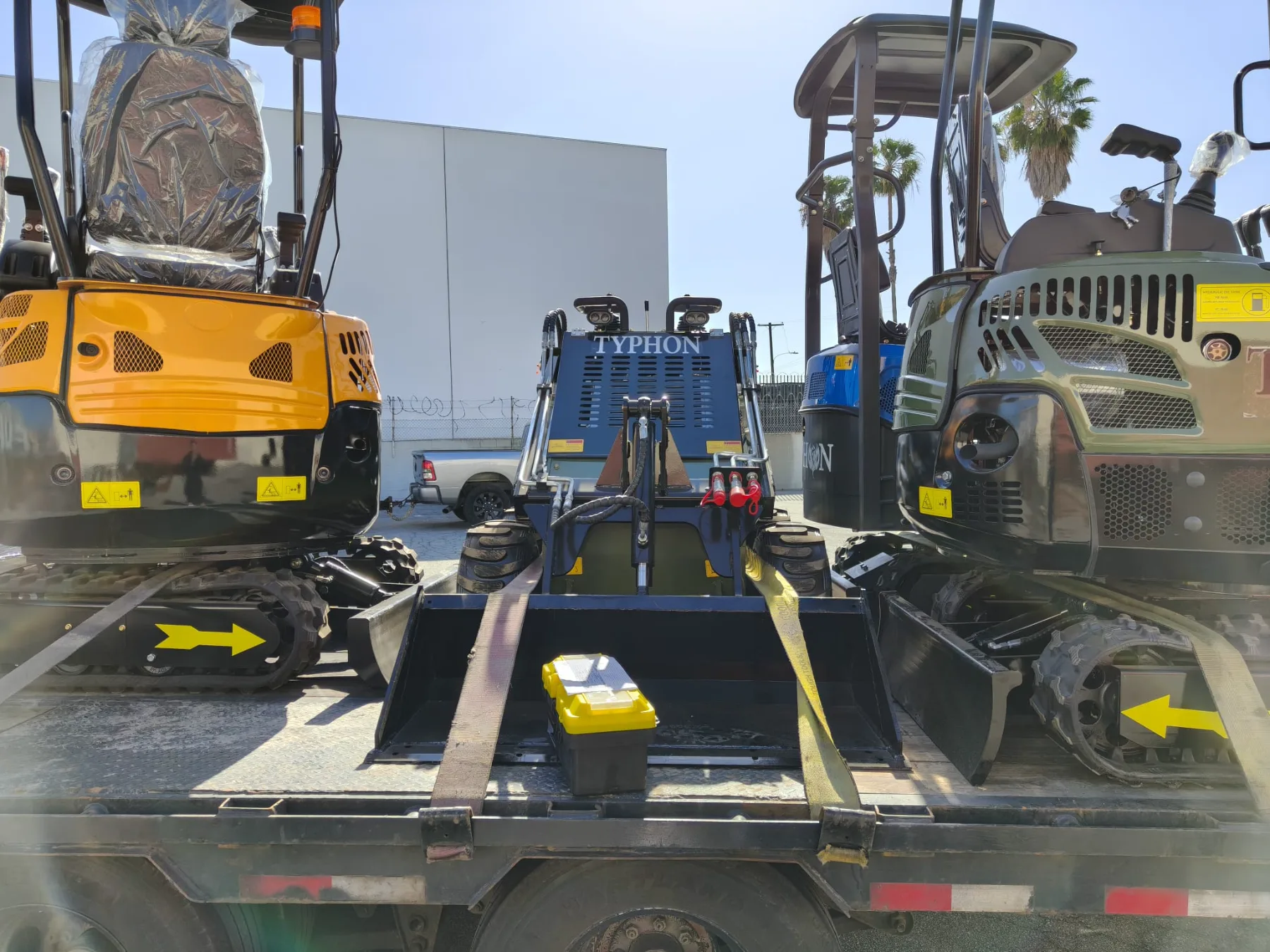 Electric and diesel forklifts lined up in distribution center