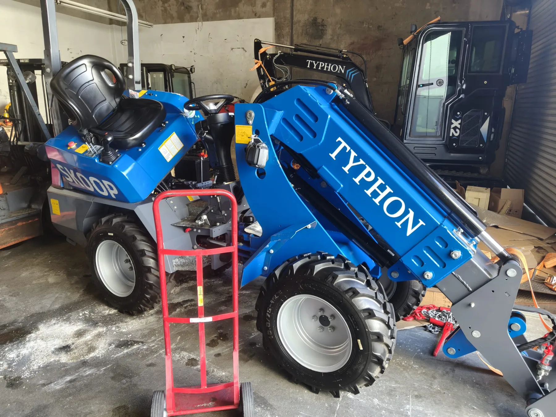 High-output LED lights mounted on boom and ROPS canopy
