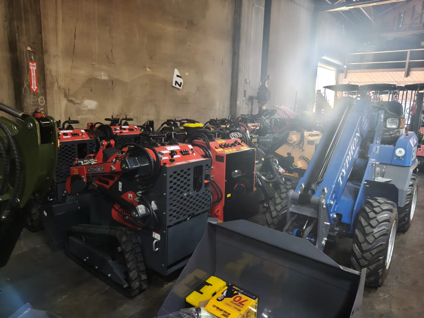 Universal skid steer mounting plate with dual locking levers