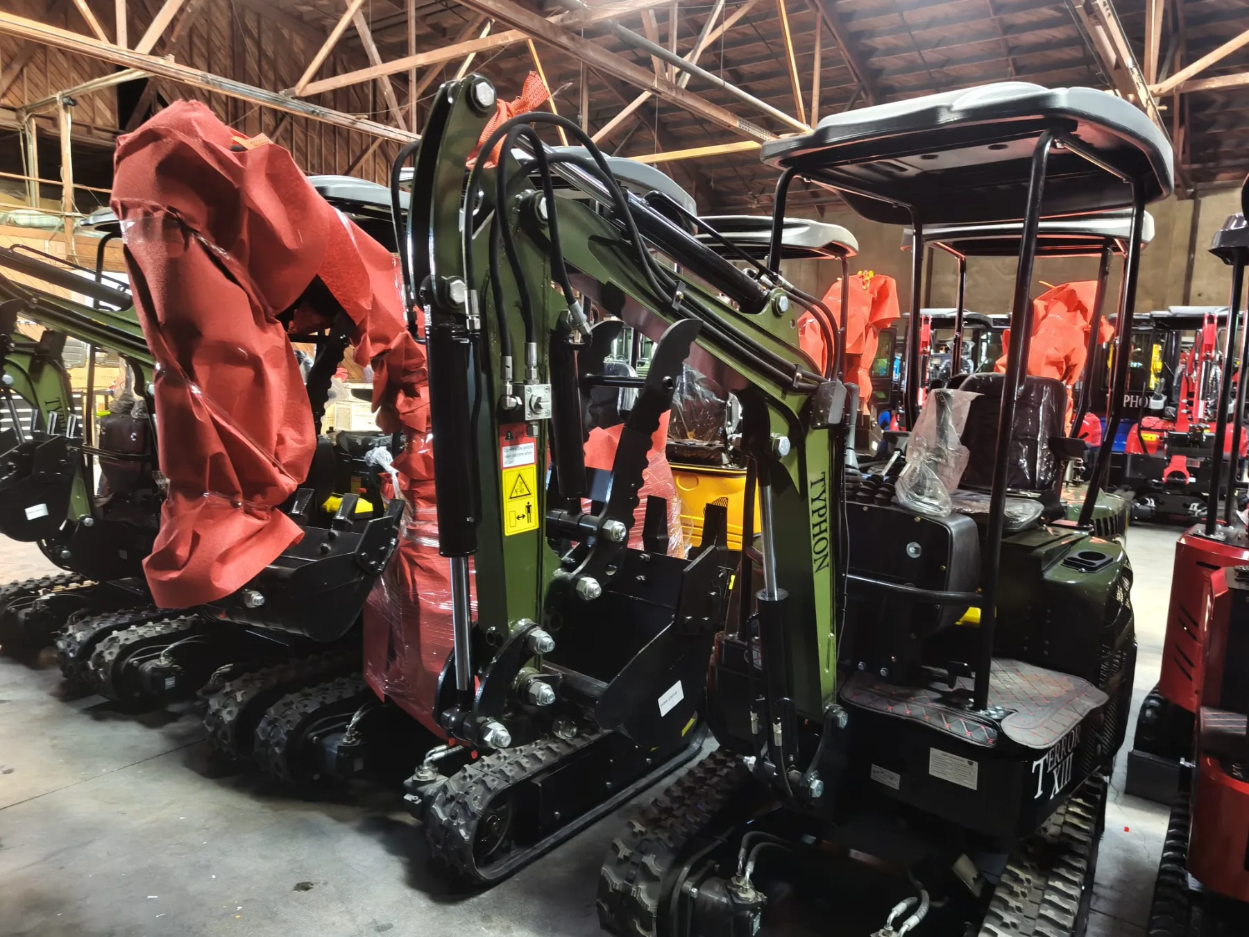 Compact excavator equipped with narrow trenching bucket