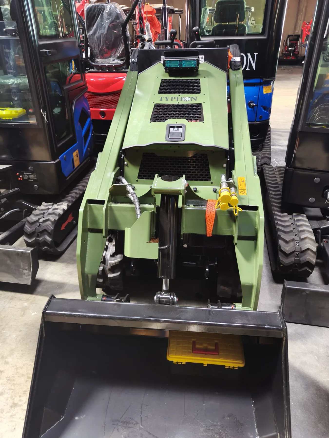 Diverse lineup of excavators, forklifts, and loaders in facility