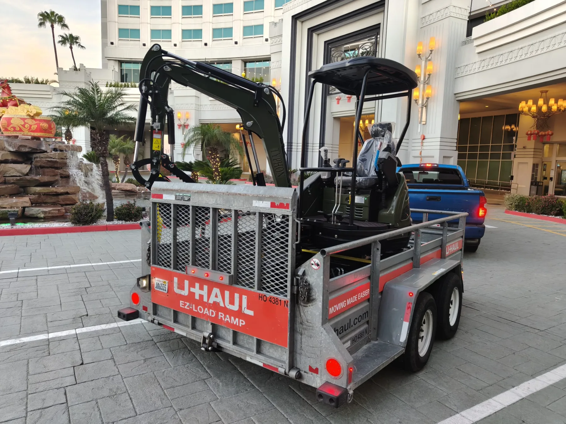 Mini excavator navigating outdoor transition ramp